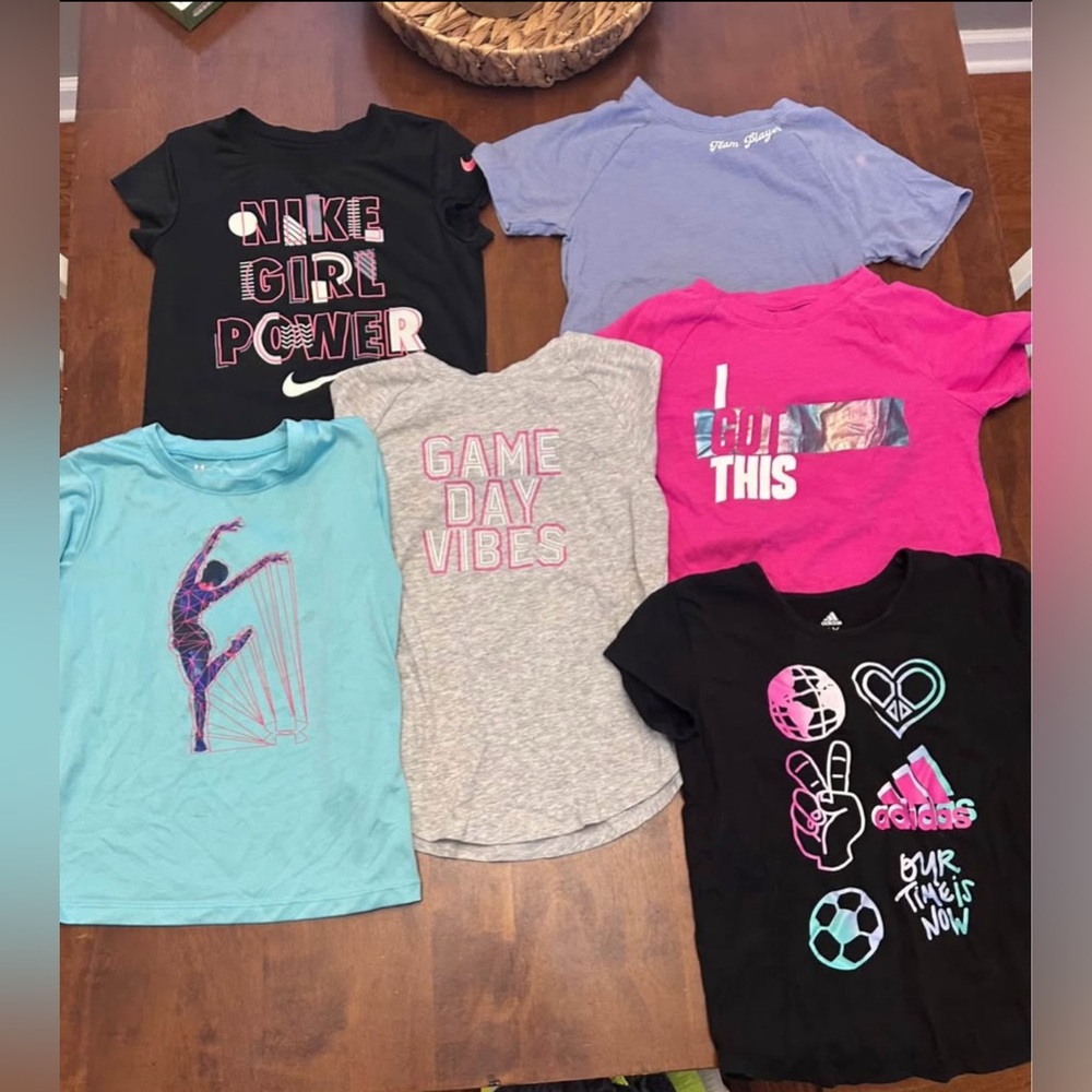 Lot of 6 girls athletic shirts. In good play condition some stains. Size 6/6x